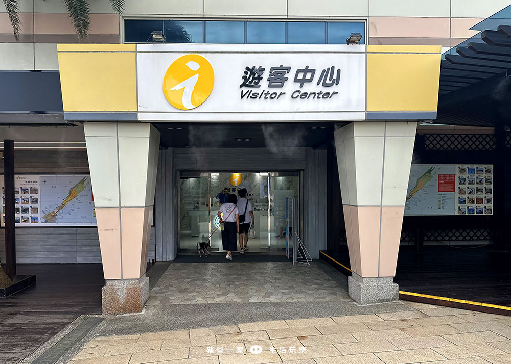 a group of people walking into a building